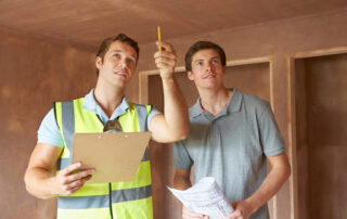 Two men performing a home inspection.