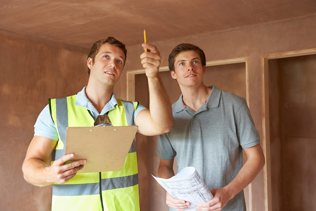 Two men performing a home inspection.